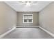 Bedroom with carpet, ceiling fan, and window at 1005 Collins Dr, Raleigh, NC 27609