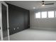 Bedroom with dark accent wall and ceiling fan at 30 Hartwood Ln, Youngsville, NC 27596