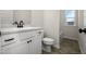 Bathroom with white vanity, black fixtures, and tile flooring at 95 Deodora Ln, Cameron, NC 28326