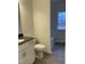 Clean and modern bathroom with wood-look flooring at 95 Deodora Ln, Cameron, NC 28326