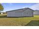 White garage with double doors and a side door at 2494 Joel Johnson Rd, Lillington, NC 27546