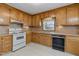 Bright kitchen with wood cabinets and appliances at 2494 Joel Johnson Rd, Lillington, NC 27546