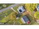 House and barn viewed from above, set on a large lot with surrounding trees at 2494 Joel Johnson Rd, Lillington, NC 27546