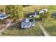 Aerial view of a home on a spacious lot with additional buildings at 2494 Joel Johnson Rd, Lillington, NC 27546