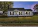 White one-story house with a spacious lawn and a tranquil setting at 2494 Joel Johnson Rd, Lillington, NC 27546