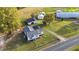 Aerial view of a house with detached workshop and large agricultural structures at 2494 Joel Johnson Rd, Lillington, NC 27546