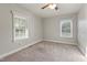 Bedroom with ceiling fan and two windows at 2494 Joel Johnson Rd, Lillington, NC 27546