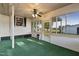 Sunroom with green carpet, ceiling fan, and heater at 2494 Joel Johnson Rd, Lillington, NC 27546
