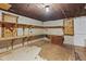 Unfinished basement area with wood shelving at 2494 Joel Johnson Rd, Lillington, NC 27546