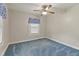 Well-lit bedroom with window and ceiling fan at 2494 Joel Johnson Rd, Lillington, NC 27546