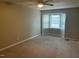 Bedroom with bay window, ceiling fan, and neutral walls at 1242 Shadowbark Ct, Raleigh, NC 27603