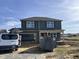 Two-story house with a gray exterior, attached garage, and visible landscaping at 48 Silver Ct, Smithfield, NC 27577