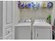 Convenient laundry room with washer, dryer, and ample storage shelves at 8520 Quarton Dr, Raleigh, NC 27616