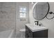 Modern bathroom with marble tile shower, updated vanity, and black accents at 623 W Club Blvd, Durham, NC 27701