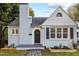 Charming light blue house with stone walkway and landscaping at 623 W Club Blvd, Durham, NC 27701