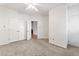 Bright bedroom with double doors and carpet flooring at 4445 Still Pines Dr, Raleigh, NC 27613