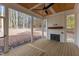Relaxing screened porch with fireplace and wood flooring at 2105 Gentry Rd, Wake Forest, NC 27587