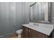 Elegant powder room with modern vanity and mirror at 2105 Gentry Rd, Wake Forest, NC 27587