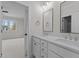 Double vanity bathroom with a large mirror and white cabinets at 2105 Gentry Rd, Wake Forest, NC 27587