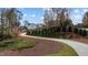 Curving concrete pathway in a wooded community with homes in the background at 2105 Gentry Rd, Wake Forest, NC 27587