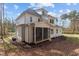 White two-story home with a screened porch at 2105 Gentry Rd, Wake Forest, NC 27587