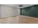Well-lit bedroom with hardwood floors and neutral decor at 2105 Gentry Rd, Wake Forest, NC 27587