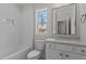 Bathroom with shower/tub combo, white tile, and vanity at 2105 Gentry Rd, Wake Forest, NC 27587