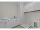 Bright laundry room with white cabinets and countertop at 2105 Gentry Rd, Wake Forest, NC 27587