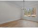 Bright dining room with hardwood floors and large window at 2105 Gentry Rd, Wake Forest, NC 27587