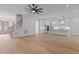 Open living room and kitchen area with hardwood floors at 2105 Gentry Rd, Wake Forest, NC 27587