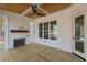 Screened porch with fireplace and wood flooring at 2105 Gentry Rd, Wake Forest, NC 27587