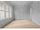 Bright dining room features hardwood floors, wainscoting, and a large window at 2105 Gentry Rd, Wake Forest, NC 27587