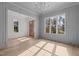 Sunlit dining room with hardwood floors and views of the backyard at 2105 Gentry Rd, Wake Forest, NC 27587