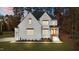 Two-story home with white brick exterior, landscaping, and a two-car garage at 2105 Gentry Rd, Wake Forest, NC 27587