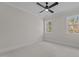 Bedroom with two windows, ceiling fan and neutral carpeting at 2105 Gentry Rd, Wake Forest, NC 27587