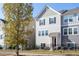 Two-story townhome with neutral siding and black accents at 535 Traditions Grande Blvd, Wake Forest, NC 27587