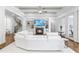 Bright living room features hardwood floors, fireplace, and built-in shelving at 204 Harvest Ln, Pittsboro, NC 27312