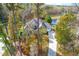 Two-story house with a large driveway and mature trees at 204 Harvest Ln, Pittsboro, NC 27312