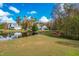 Peaceful backyard view of home and pond at 204 Harvest Ln, Pittsboro, NC 27312