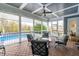 Relaxing screened porch overlooking the pool and backyard at 204 Harvest Ln, Pittsboro, NC 27312