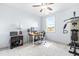 Home office with large windows, desk, and exercise equipment at 204 Harvest Ln, Pittsboro, NC 27312