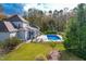 Luxury home with a beautiful, expansive pool and patio at 204 Harvest Ln, Pittsboro, NC 27312