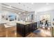 Open concept kitchen with large island and breakfast area, overlooking living room at 204 Harvest Ln, Pittsboro, NC 27312