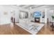 Spacious living room with hardwood floors, fireplace, and built-in shelving at 204 Harvest Ln, Pittsboro, NC 27312