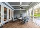 Spacious screened porch with seating area and pool view at 204 Harvest Ln, Pittsboro, NC 27312