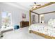 Main bedroom with four-poster bed, dresser and view of backyard at 204 Harvest Ln, Pittsboro, NC 27312