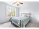 Cozy bedroom with light walls and metal framed bed at 204 Harvest Ln, Pittsboro, NC 27312