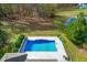 Inviting rectangular pool with a large patio area at 204 Harvest Ln, Pittsboro, NC 27312
