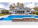 Inviting swimming pool with stone coping and patio area at 204 Harvest Ln, Pittsboro, NC 27312