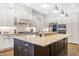 Spacious kitchen with granite countertops, custom cabinetry, and stainless steel appliances at 204 Harvest Ln, Pittsboro, NC 27312